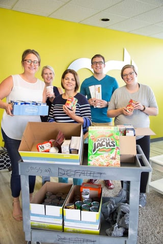 OneClick Team collecting canned foods