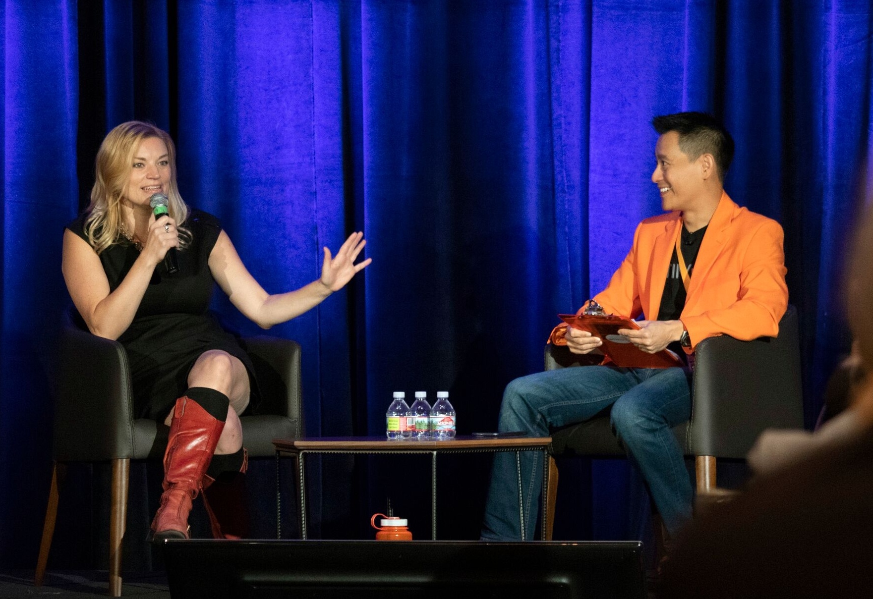 David Niu and Sarah Bird chat on stage for a fireside chat