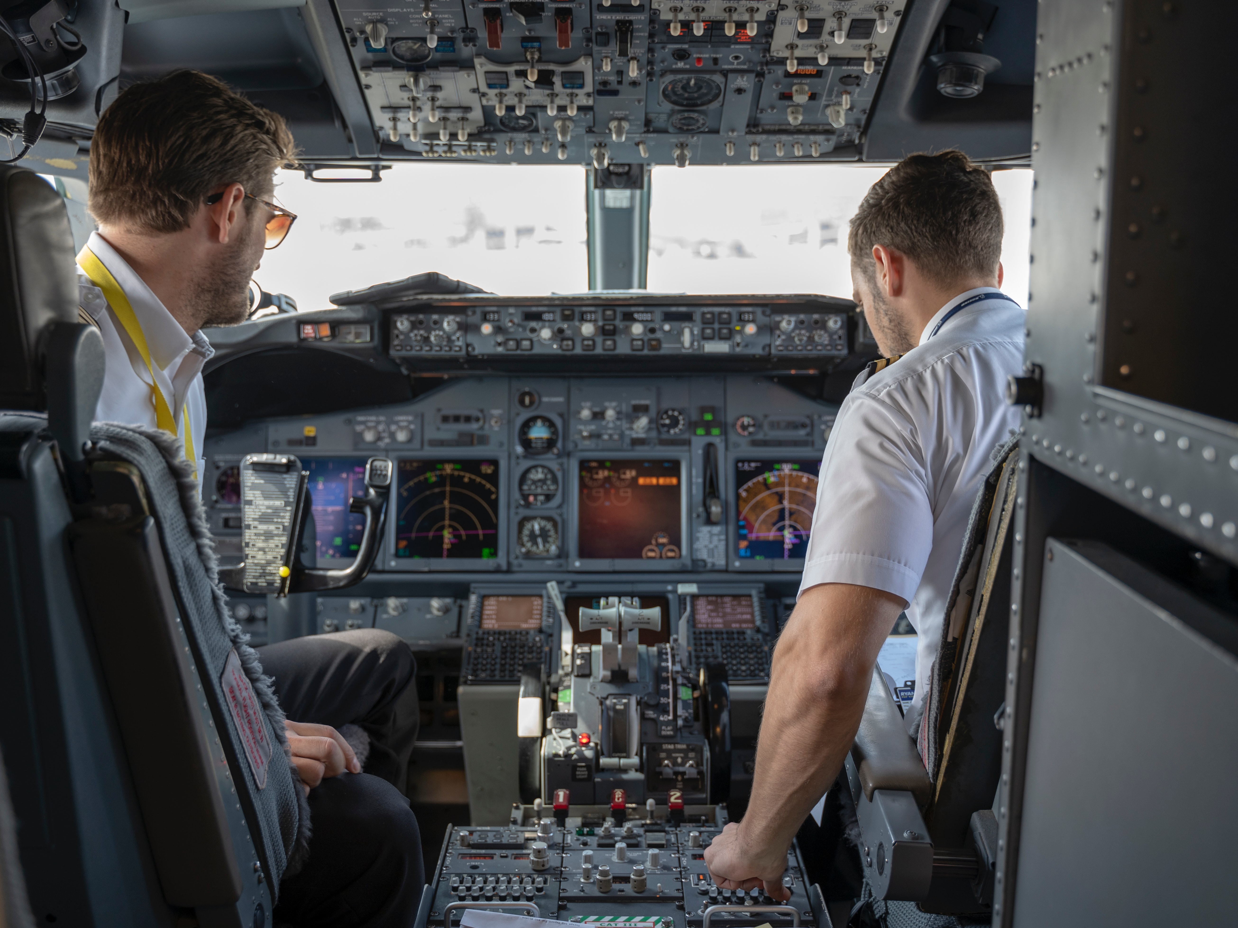 two-pilots-sitting-inside-plane-2064123